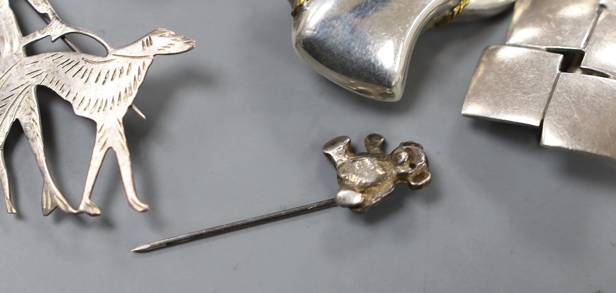 Sterling jewellery to include two pairs of earrings, a brooch and a tiepin.